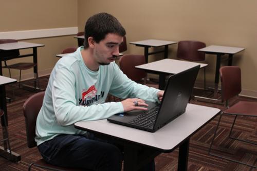 Senior working on laptop